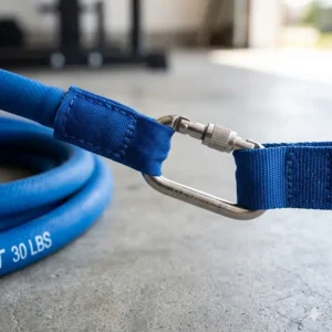 Close-up detail of the heavy-duty stainless steel carabiner on exercise bands with clips.