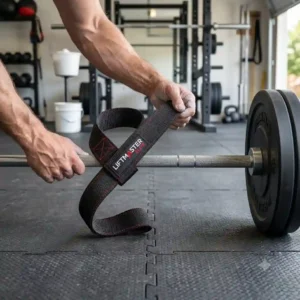 A close-up of a weightlifter wrapping lasso-style best lifting straps for weightlifting around a barbell.
