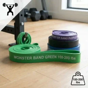 Fitness enthusiast using a green monster bands to perform a lying hamstring stretch for lower body mobility.